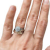 diamond halo flower ring on a hand