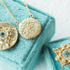 Gold mandala necklace with diamonds and teal sapphire