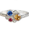 Custom family ring with birth stones: citrine, ruby, sapphire set in white gold
