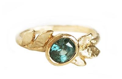 Oval teal sapphire ring with golden leaves