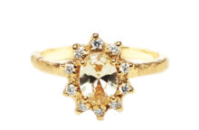 Yellow sapphire and a halo of diamonds vintage rosetta ring