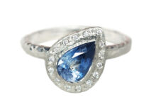 blue sapphire pear and a halo of diamonds white gold ring