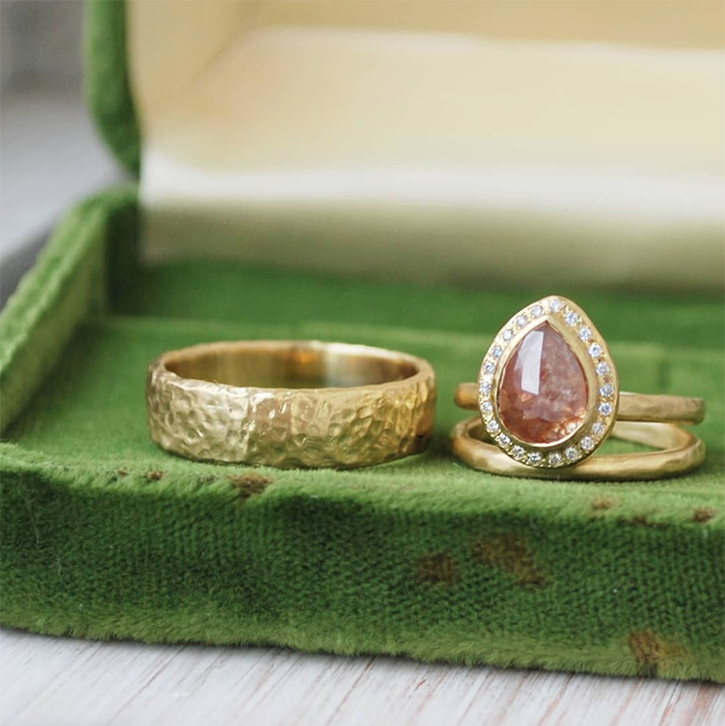 Custom diamond halo ring with textured gold mens wedding band