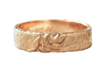Alternative Mens Wedding band in hammered gold with a branch of sculpted leaves