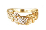 Hammered gold leaves wreath ring with a central diamond