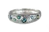 custom textured white gold ring with green sapphires, made in Toronto