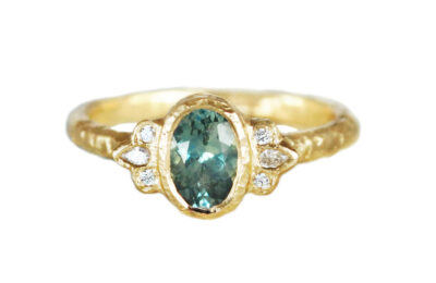 oval green sapphire with pear diamond accents, hammered gold ring