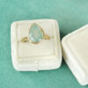 milky aquamarine pear ring in yellow gold