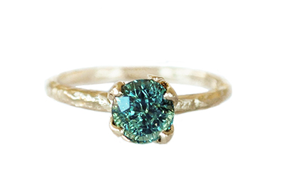 Teal sapphire boho engagement ring with hammered gold leaves