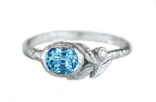 Light Blue Sapphire white hammered gold boho ring with leaves and an accent diamond