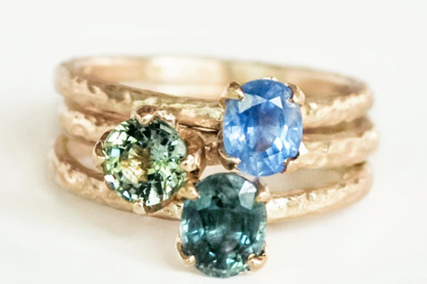 hammered gold rings with colourful gemstones, blue and teal sapphires
