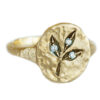 oval signet ring with diamonds and golden leaves