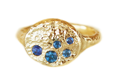 rustic blue sapphire signet ring with hammered gold