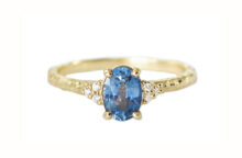 Oval blue sapphire ring with diamonds and hammered gold