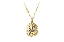 Three leaf branch with accent diamonds on an oval gold medallion necklace