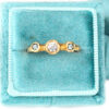 Three drops sapphire and diamond trinity ring in a velvet box