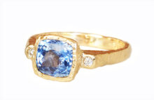 Blue sapphire cushion ring with diamonds