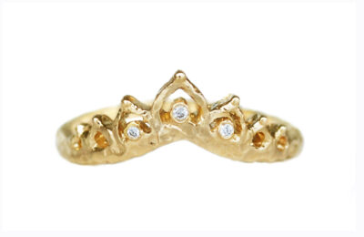 Curved textured gold v-band with ornate arches and three accent diamonds