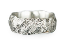 high textured gold wedding band in white gold