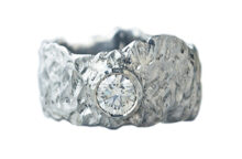 Deep textured white gold ring with a round diamond, made by hand in Canada