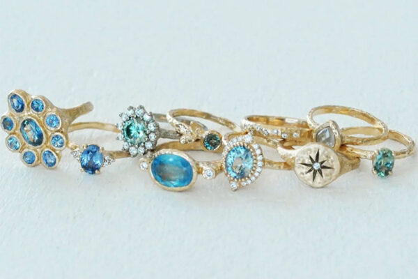 Grouping of artisanal gold rings with blue sapphires, aquamarines and diamonds