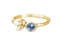 Blue sapphire ring with golden leaves