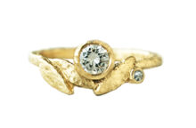 Golden leaf ring with a diamond and an accent diamond