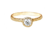 Delicate hammered gold ring with Canadian diamond