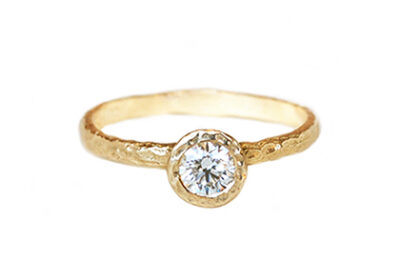 Delicate hammered gold ring with Canadian diamond