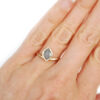 marquise cut grey diamond ring in hammered gold on hand