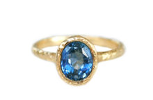 Light blue oval sapphire hammered gold ring
