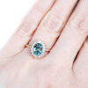 Engagement ring with teal sapphire and diamonds