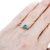 Nature inspired golden leaf ring with blue green sapphire