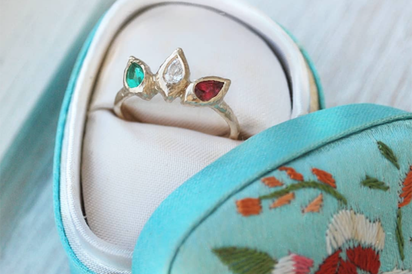 Custom hammered gold ring with ruby, emerald and diamond marquise gemstones