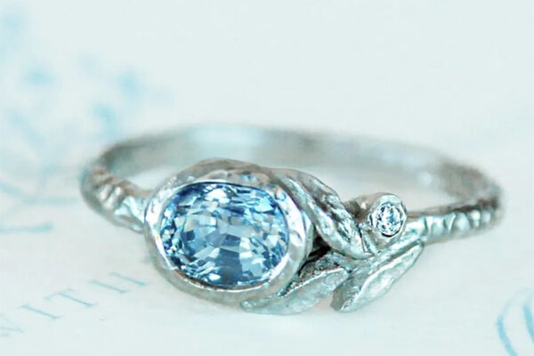 White gold nature inspired leaf ring with blue sapphire and diamond