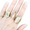 hammered gold goddess statement rings grouping on hand
