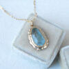 Roughly cut aquamarine pendant on a 18" gold chain, in a vintage box