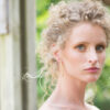 hammered gold bar earrings on a model