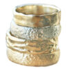White and yellow mens wedding bands with texture, grooves and hammering