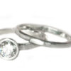 Organic white gold wedding band with a diamond solitaire
