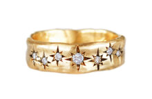 Organic texture wedding band with seven diamond stars