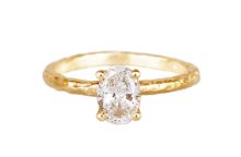 oval lab diamond alternative engagement ring in textured gold