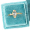 Oval diamond dainty vintage style ring with tiny diamonds, blue velvet ring box