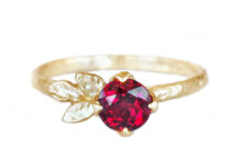 birthstone ruby ring with golden leaves, set in prongs