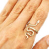 spiritual talisman serpent gold ring on a hand