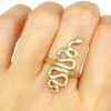 large golden serpent ring on a hand