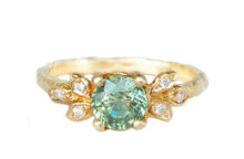 Round green sapphire ring with golden leaves and accent diamonds
