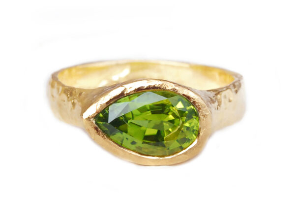 custom gold ring with a pear peridot