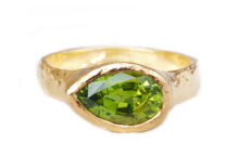 Custom peridot pear ring in hammered gold