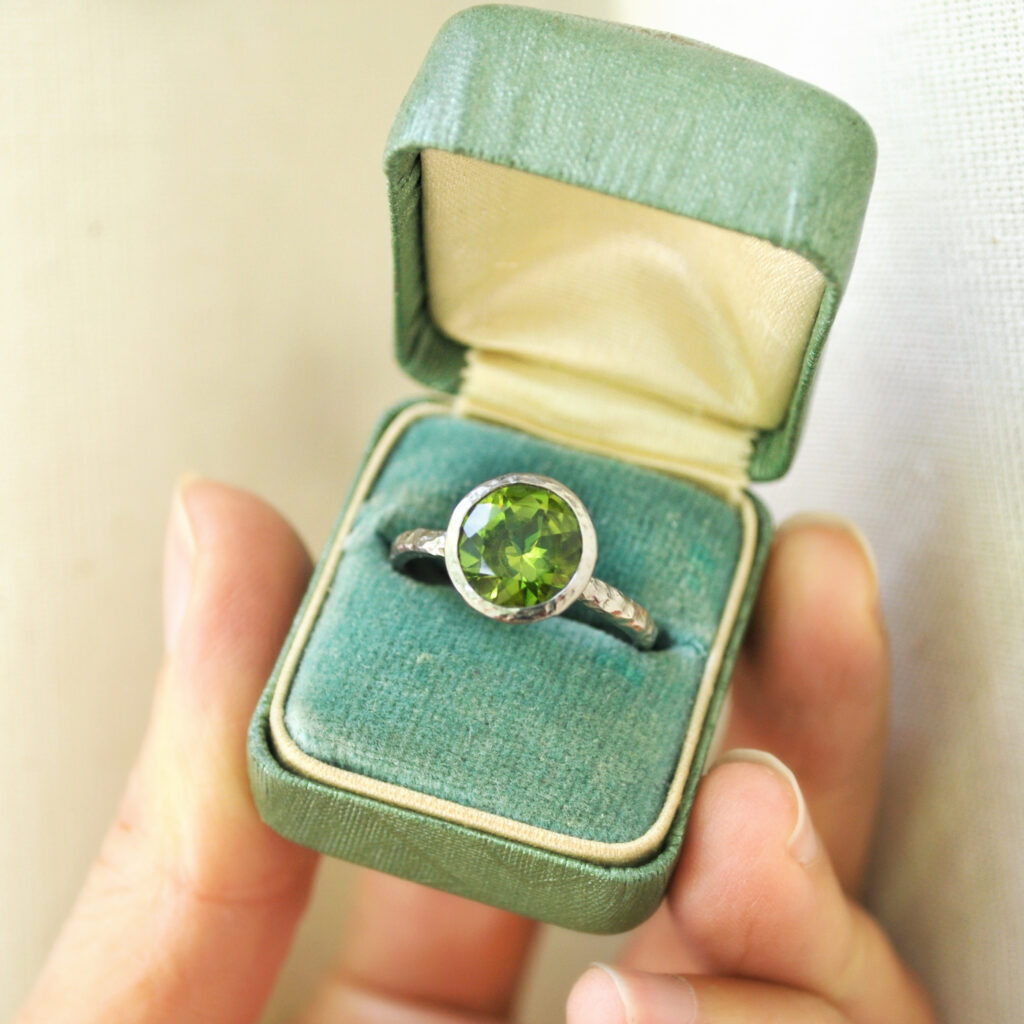 Custom gold ring solitaire with a large peridot gemstone